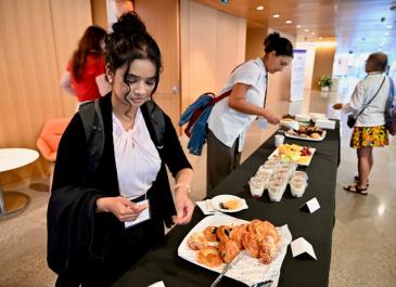 Attendees at the continental breakfast buffet