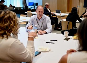 Attendees smiling and engaging before the event start