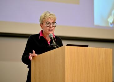 Krista Carr at the podium