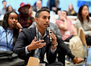 An attendee asking a question from the audiance