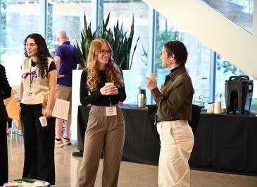 Attendees enjoying coffee at the break