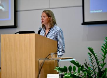 Anna Nelson at the podium