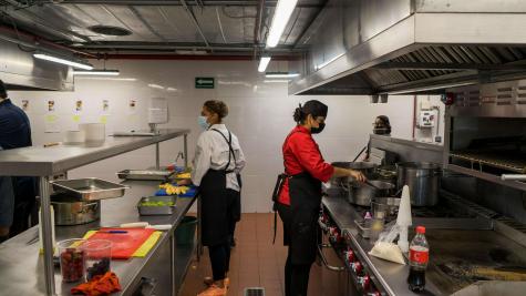 people working in a kitchen