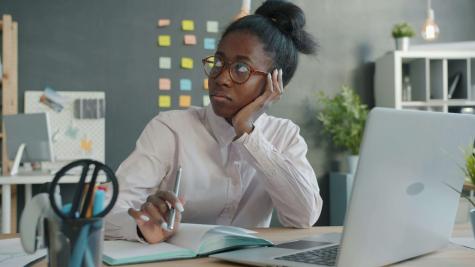 a woman at work looking into the distance