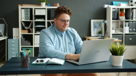 a man working at his laptop