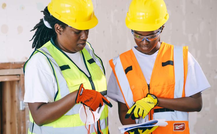 construction workers looking at plans