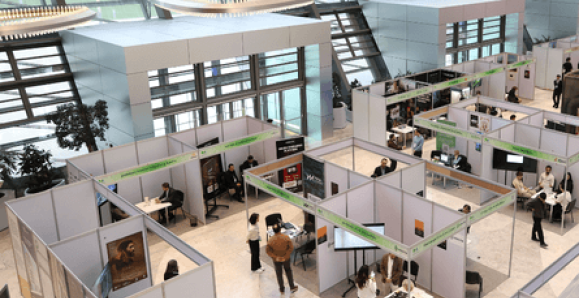 people networking and exploring booths at a career fair