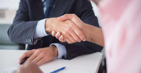 two people shaking hands