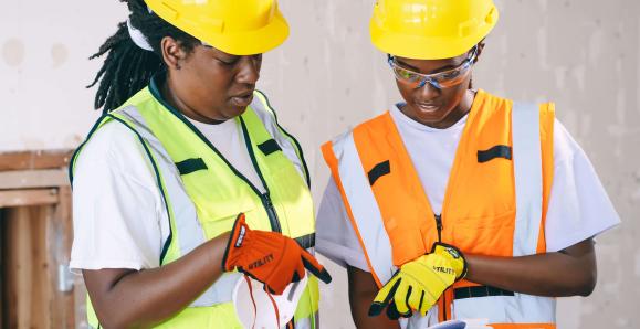 construction workers looking at plans
