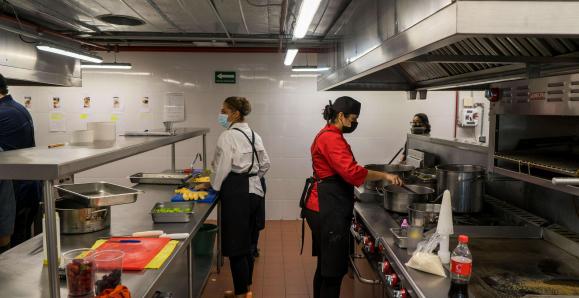 people working in a kitchen