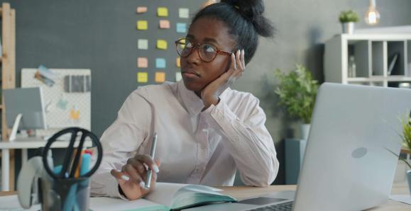 a woman at work looking into the distance