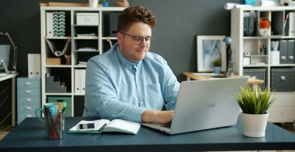 a man working at his laptop