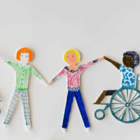 diverse paper cutout figures holding hands
