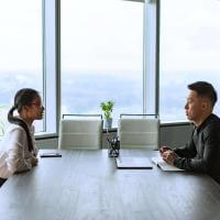 Man and woman sitting face to face across a table