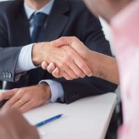 two people shaking hands