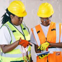construction workers looking at plans