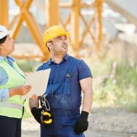 construction workers looking on a work site 