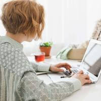 a woman working on her laptop
