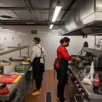 people working in a kitchen