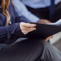 A woman looking at a notebook